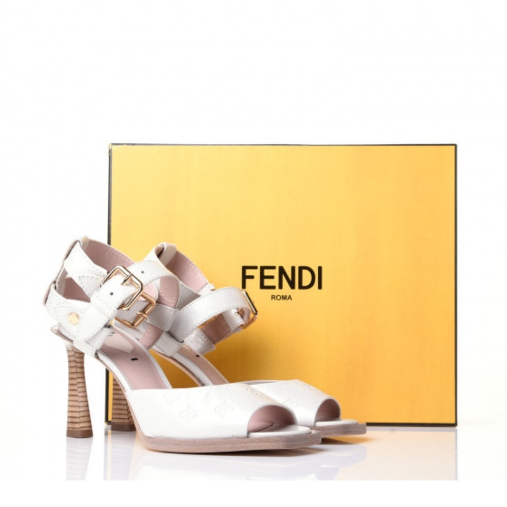 FENDI
Vitello Karligraphy Embossed FFrame Ankle Strap Sandals size 39 White